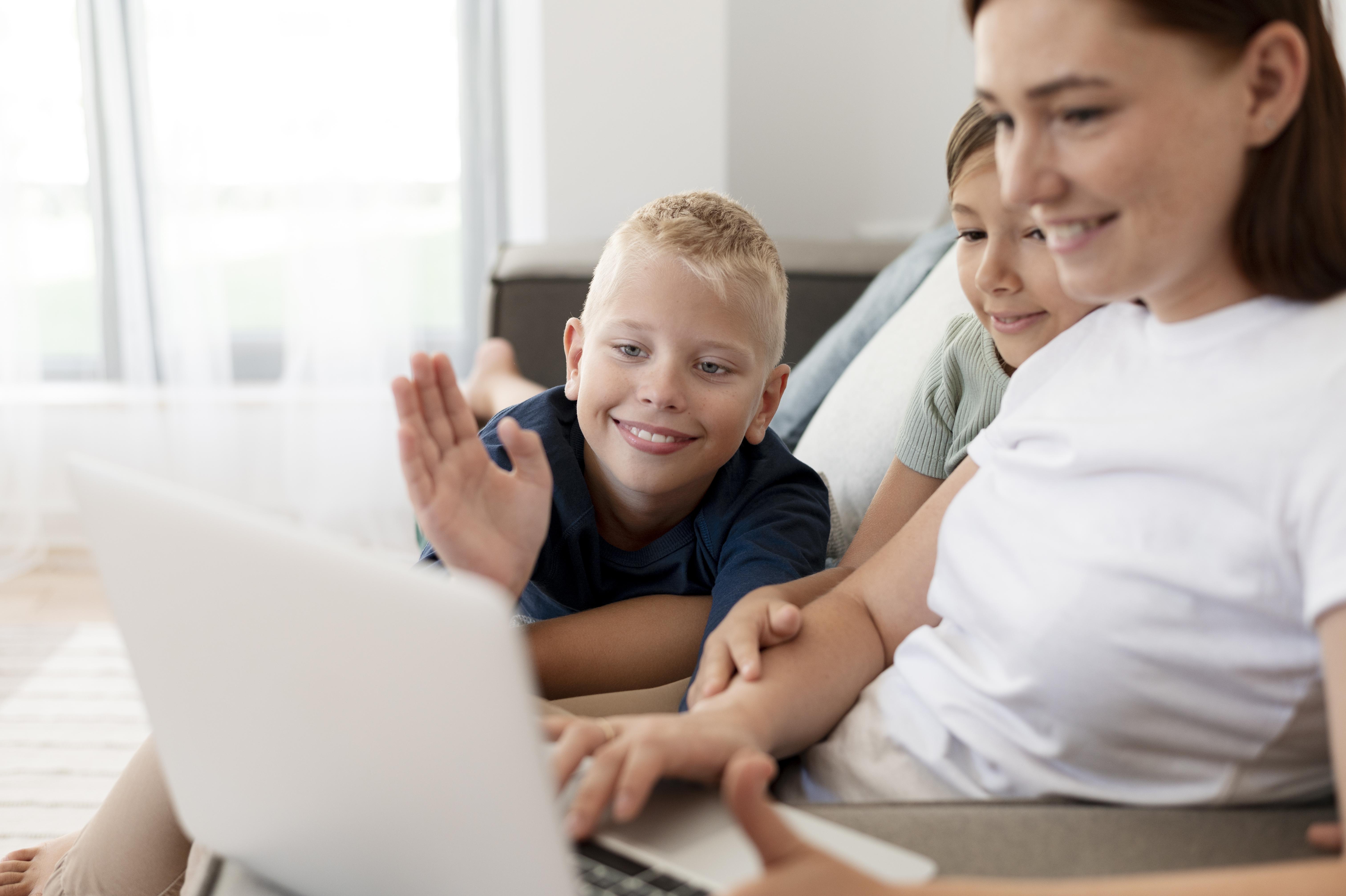 happy family learning together around a computer online learning is fun